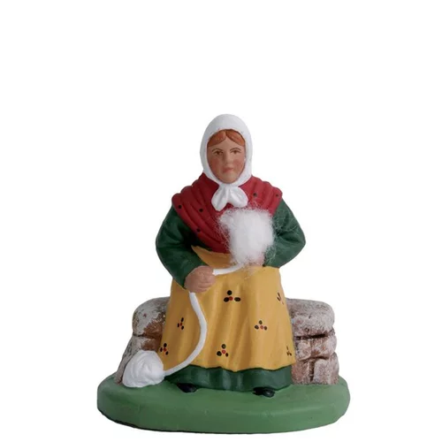Équipement pour le jardin:Santon pour crèche fileuse assise jaune - 7 cm
